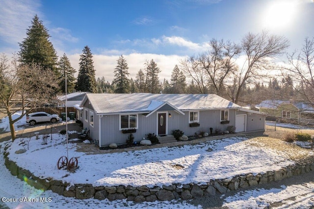 single story home featuring a garage