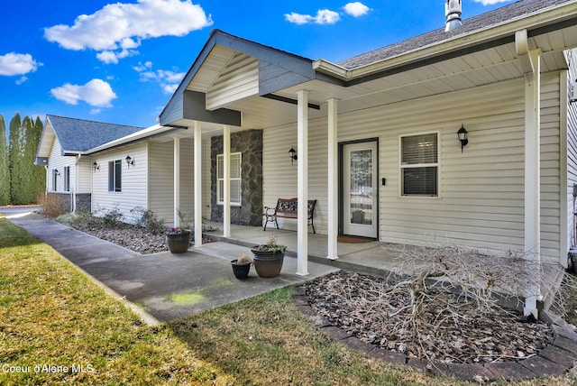 view of exterior entry featuring a porch