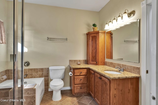 full bathroom featuring independent shower and bath, vanity, tile patterned floors, and toilet