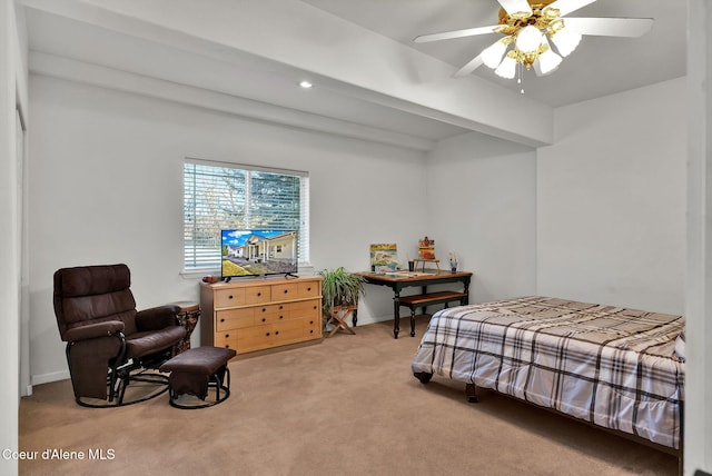 bedroom with beamed ceiling, light colored carpet, and ceiling fan