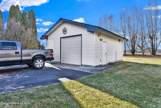 garage featuring a yard