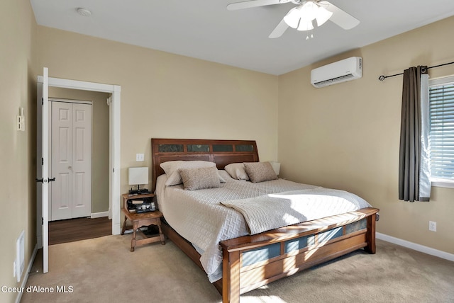 bedroom featuring light carpet, a wall mounted air conditioner, and ceiling fan