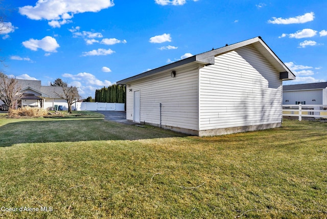 view of side of property featuring a yard