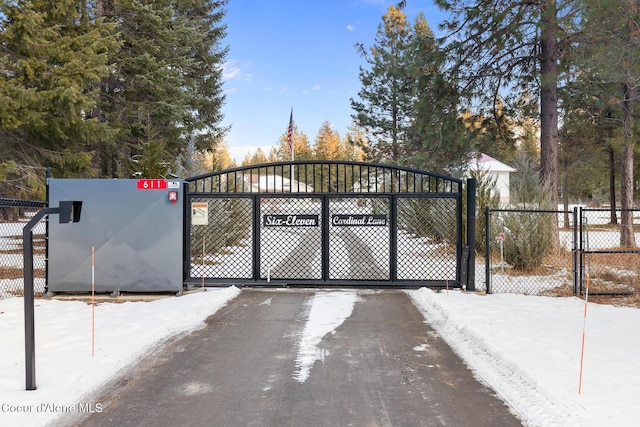 view of snow covered gate