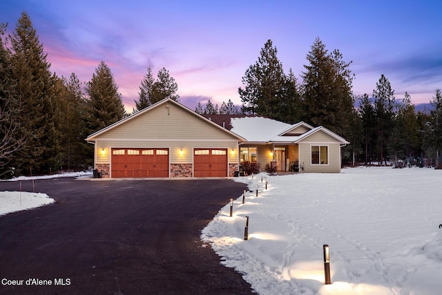 ranch-style house featuring a garage