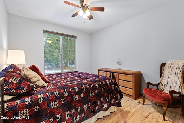 bedroom featuring ceiling fan and hardwood / wood-style flooring