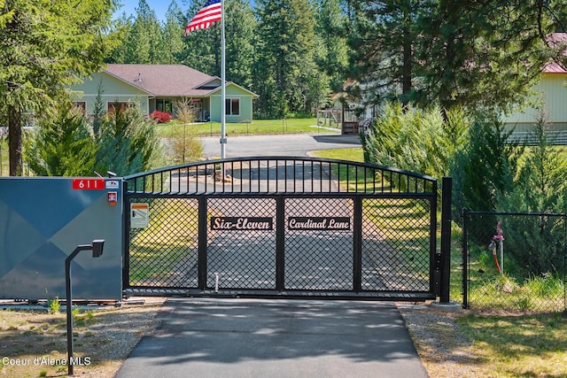 view of gate featuring fence