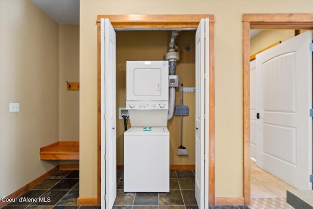 washroom with stacked washer / drying machine