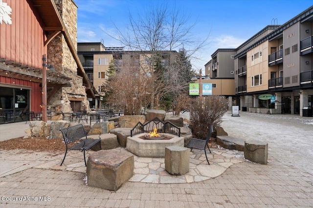 view of patio with an outdoor fire pit