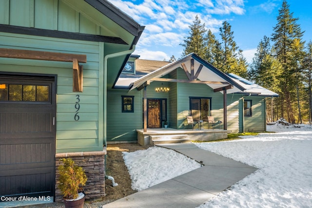 property entrance featuring covered porch