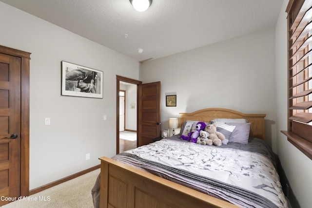 bedroom featuring light colored carpet