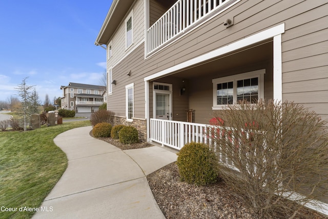 view of property exterior with a yard