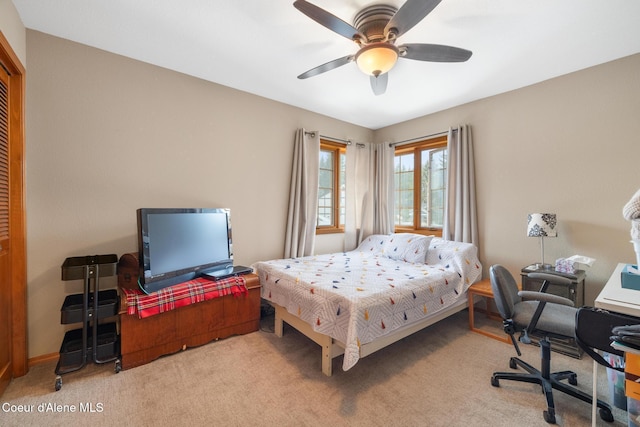 carpeted bedroom with ceiling fan