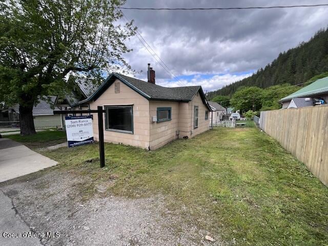 713 Upper Third St, Kellogg, ID 83837 - view of property exterior featuring a chimney