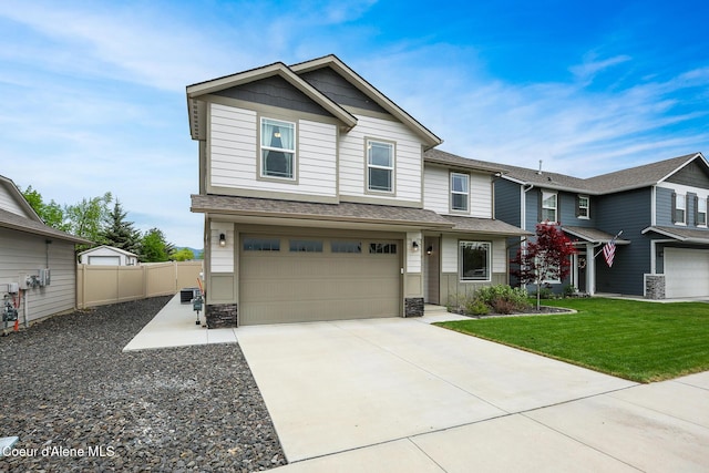 view of front of home featuring a garage and a front lawn