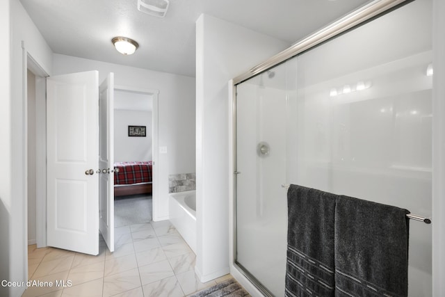 bathroom featuring plus walk in shower