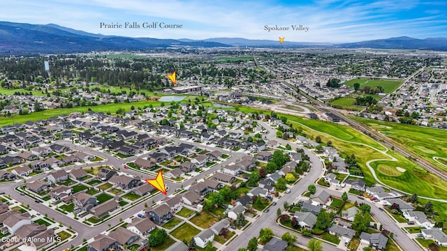 birds eye view of property featuring a mountain view