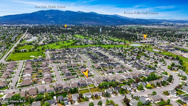 birds eye view of property with a mountain view