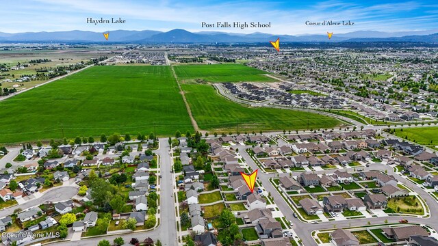 birds eye view of property featuring a mountain view