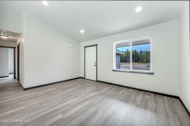 211 Rain Dr, Athol, ID 83801 - spare room with visible vents, baseboards, recessed lighting, light wood-style flooring, and vaulted ceiling