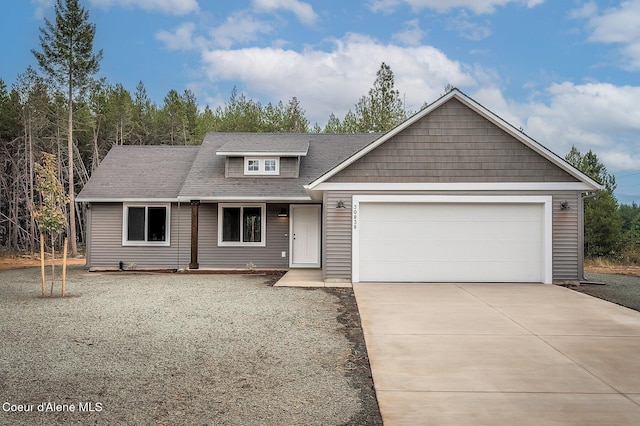 211 Rain Dr, Athol, ID 83801 - view of front facade featuring a garage, driveway, and roof with shingles