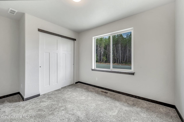211 Rain Dr, Athol, ID 83801 - unfurnished bedroom with visible vents, baseboards, and carpet floors