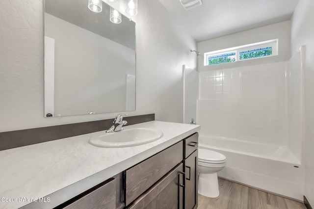 211 Rain Dr, Athol, ID 83801 - full bathroom featuring visible vents, wood finished floors, vanity, toilet, and shower / bathtub combination