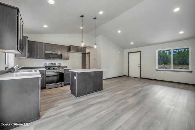 211 Rain Dr, Athol, ID 83801 - kitchen featuring appliances with stainless steel finishes, hanging light fixtures, a center island, a sink, and light countertops