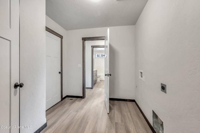 211 Rain Dr, Athol, ID 83801 - laundry area featuring hookup for an electric dryer, laundry area, baseboards, hookup for a washing machine, and light wood-style flooring