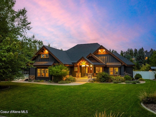 craftsman-style home featuring a yard