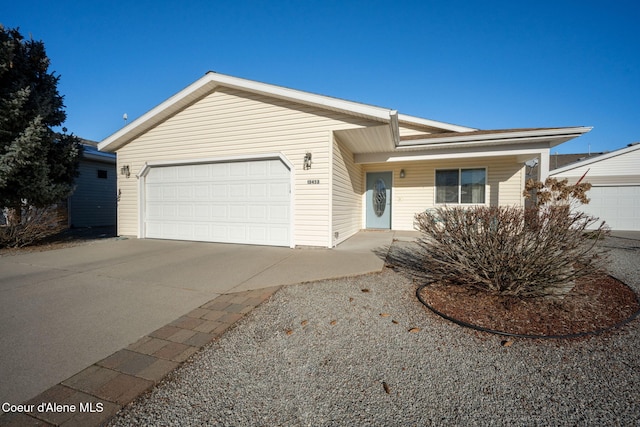 ranch-style house featuring a garage