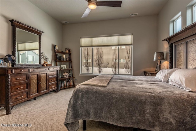 carpeted bedroom with ceiling fan