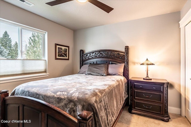 carpeted bedroom with ceiling fan