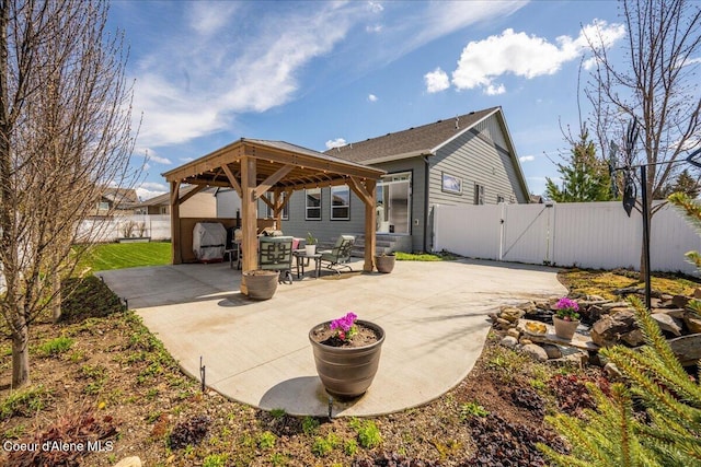 back of house with a gazebo and a patio area