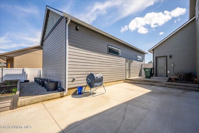 exterior space featuring central air condition unit and a patio area