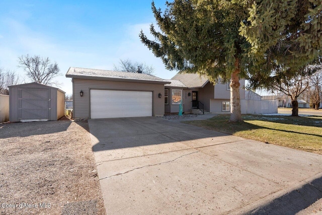 view of front of house featuring a garage, a front yard, and a storage unit