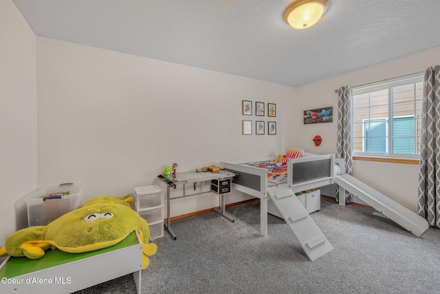 bedroom with a textured ceiling and carpet