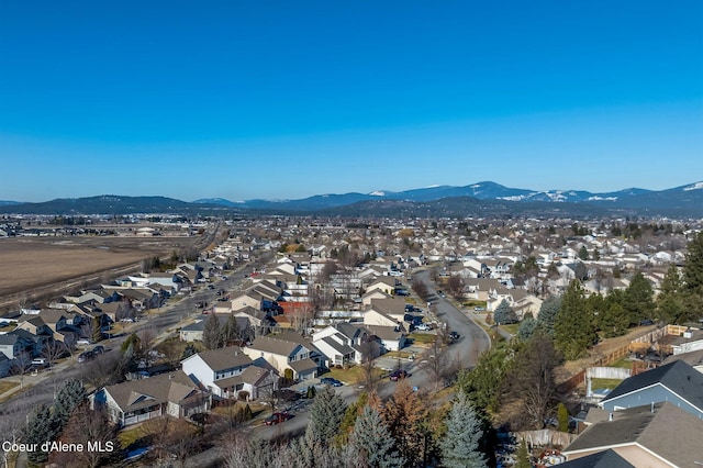 birds eye view of property featuring a mountain view