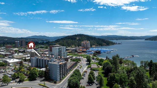 drone / aerial view featuring a water and mountain view