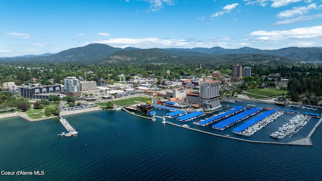 bird's eye view with a water and mountain view