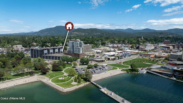 birds eye view of property featuring a water and mountain view