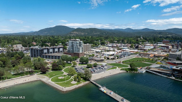 drone / aerial view with a water and mountain view