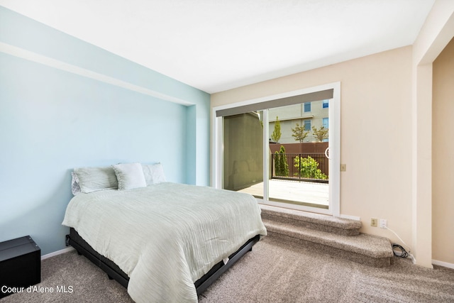 carpeted bedroom featuring access to outside