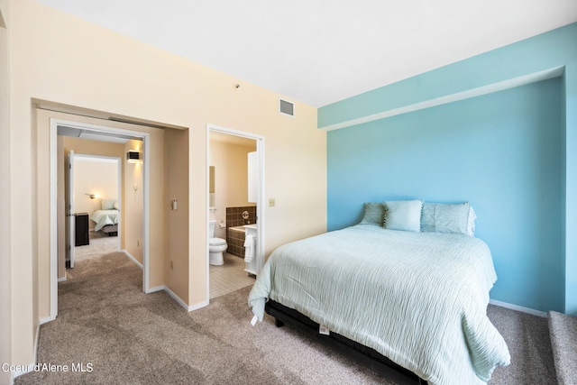 carpeted bedroom featuring connected bathroom