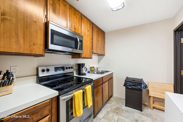 kitchen featuring appliances with stainless steel finishes and sink