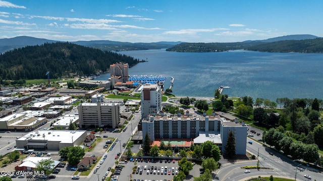 drone / aerial view with a water and mountain view