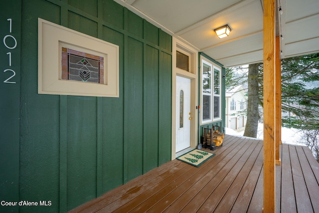 wooden terrace featuring covered porch