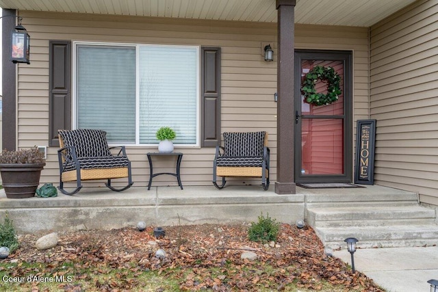 view of exterior entry featuring a porch