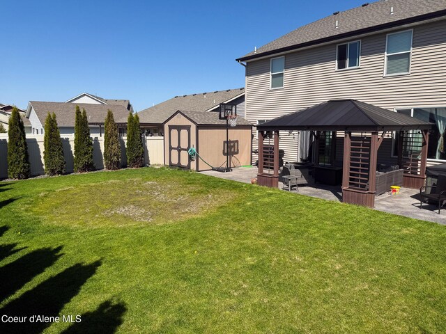 2126 Lapwai Ave, Post Falls, ID 83854 - view of yard featuring a gazebo, a storage shed, a patio, and an outbuilding