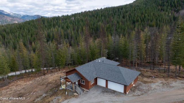 aerial view with a view of trees and a mountain view